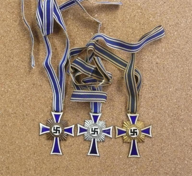 THREE UN-CASED MOTHERS CROSSES.